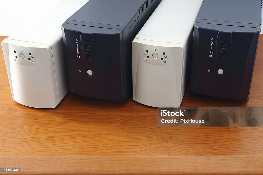Uninterruptible Power Supply Uninterruptible power supply (UPS) devices in a row. Power Supply Stock Photo