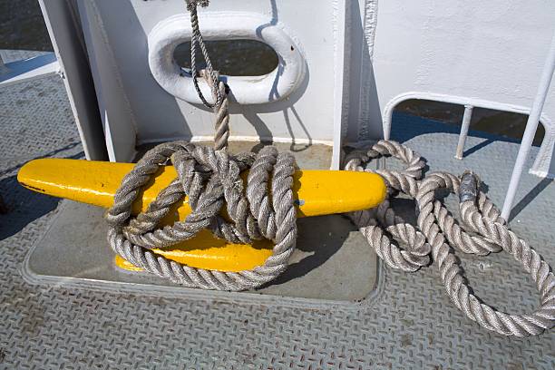 istock Big yellow cleat with rope on ferry 453011621