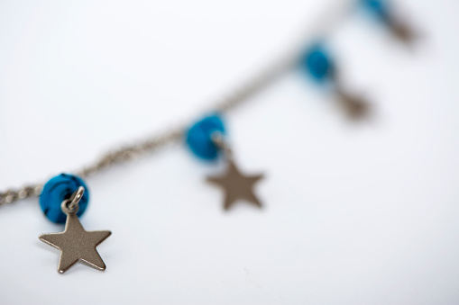 Star blue beaded necklace,on a white background.
