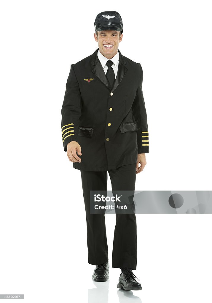 Happy airline pilot walking Happy airline pilot walkinghttp://www.twodozendesign.info/i/1.png 30-39 Years Stock Photo