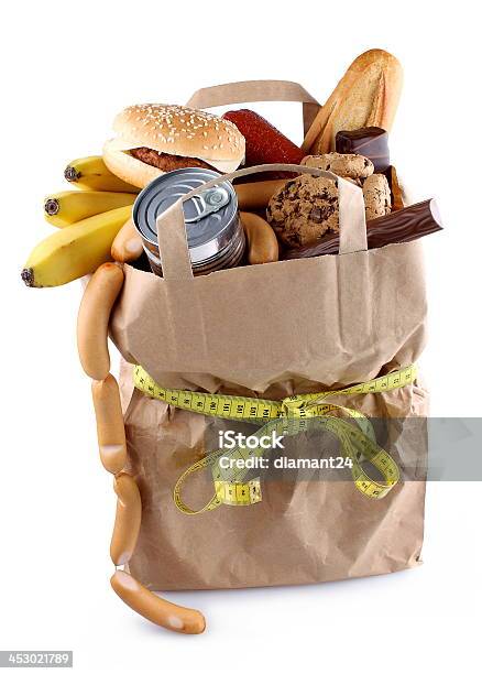 Bolsa De Papel Con Alimentos Y Alta En Calorías Cinta Métrica Foto de stock y más banco de imágenes de Alimento