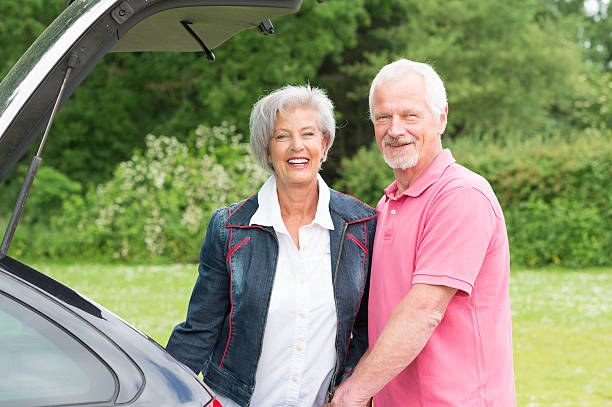 istock Senior couple with black car 453025337
