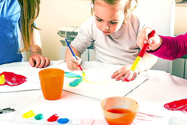 istock Little girl painting. 453028891