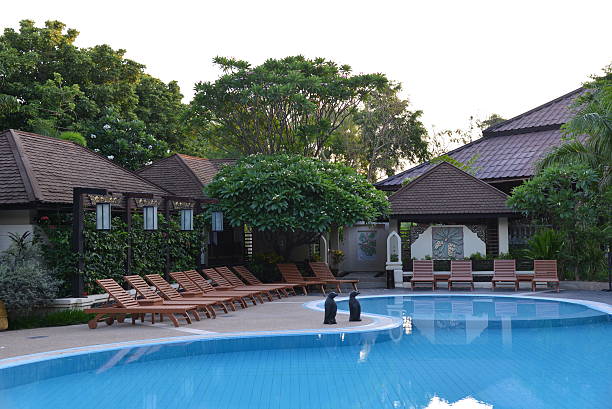 istock Swimming pool and wooden chair 453031981