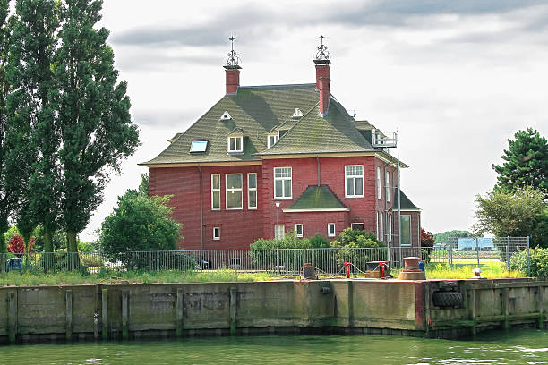Suburban brick house on the canal. Netherlands