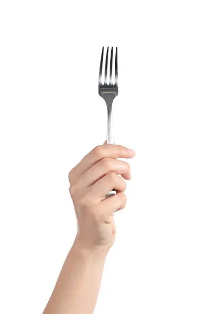Woman hand holding up a fork isolated on a white background