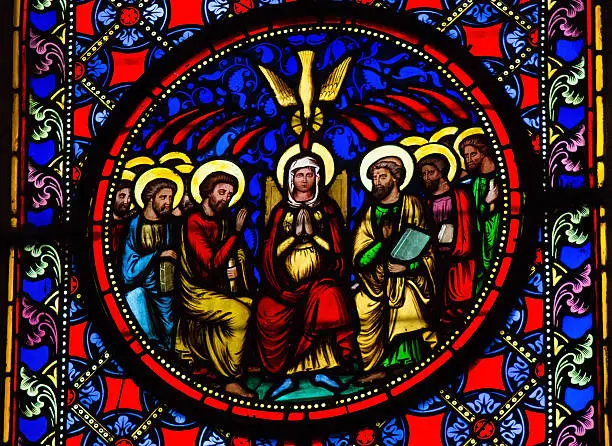 Stained Glass window depicting Pentecost, in Bayeux, Calvados, France. This window was created in the 19th Century. No property release is required.