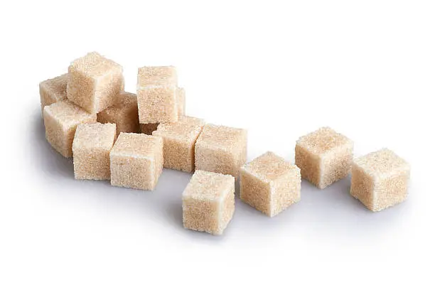 Cane sugar cubes on a white background