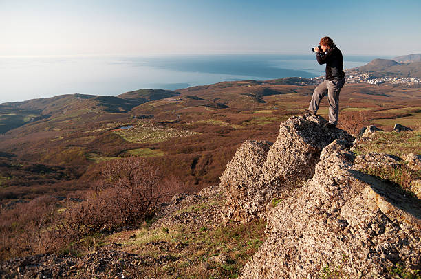 istock Photographer on the top of world 453036667