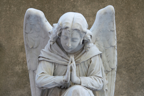 Marble sculpture of angel on a tombstone