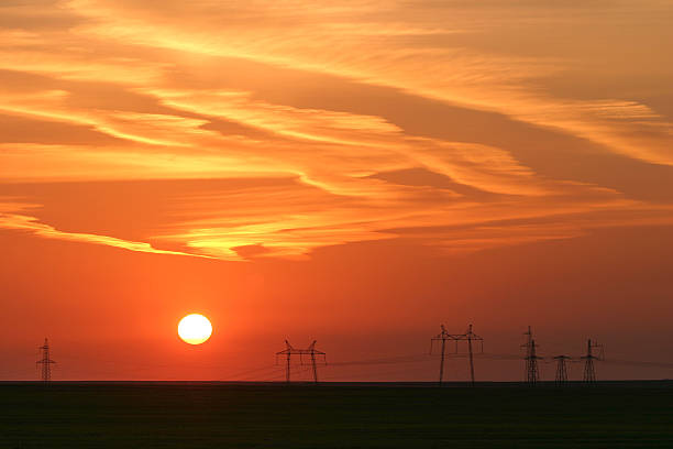 istock Power lines against the background of a beautiful sunset 453038963