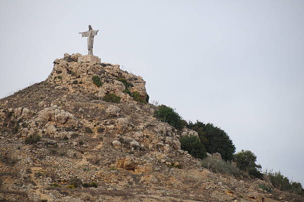 Christ statue in Marsalforn valley. Properly named Tas- Salvatur ,'the Redeemer' erected in the 70's replacing earlier wooden crosses.