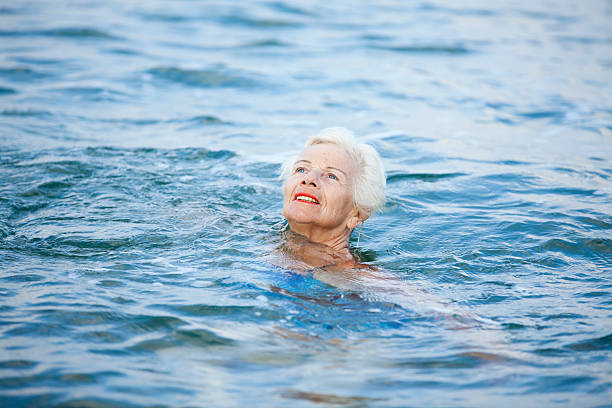 istock Senior woman in the sea 453044357