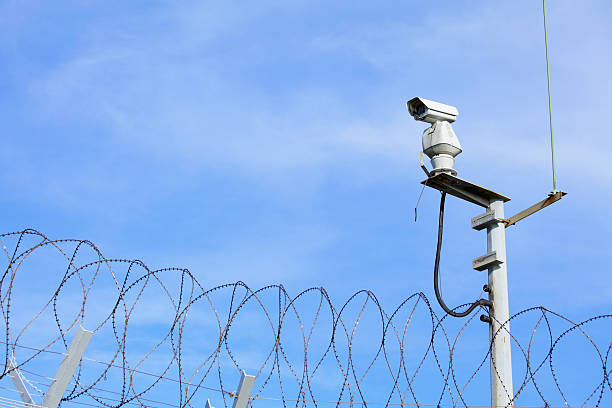 istock CCTV on top of chain link 453046837
