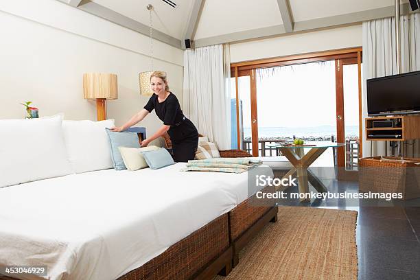 Hotel Chambermaid Making Guest Bed Stock Photo - Download Image Now - Bed - Furniture, Bedroom, Cleaning