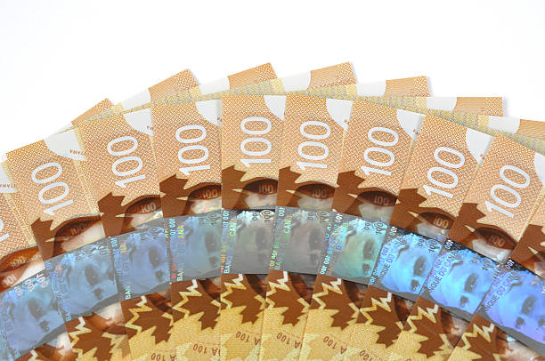 neue rechnungen canadian 100,-us-dollar - canadian dollars canada bill one hundred dollar bill stock-fotos und bilder