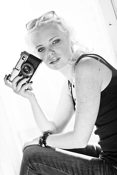 istock woman photographer with camera 453049063