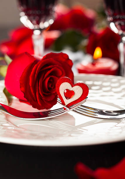 istock Valentine's table place setting with red rose and heart 453052199