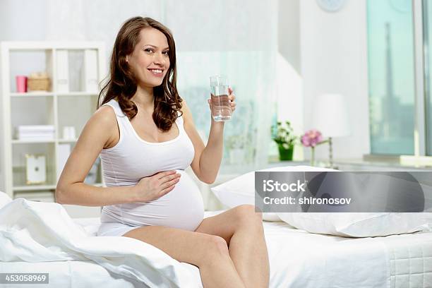 Woman On Bed Stock Photo - Download Image Now - Abdomen, Adult, Adults Only