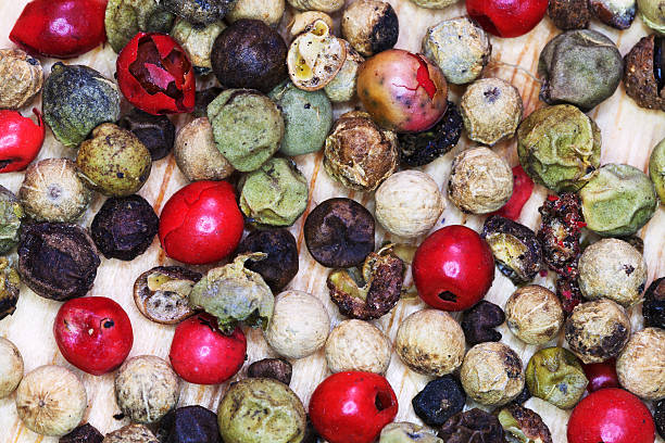 different peppercorns close up top view of different peppercorns close up spicery stock pictures, royalty-free photos & images