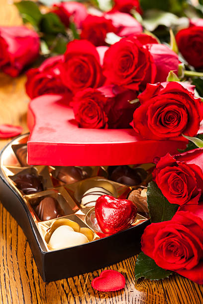 istock box of chocolate truffles with red roses 453064659