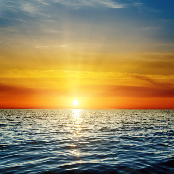 orange sunset over dark blue sea