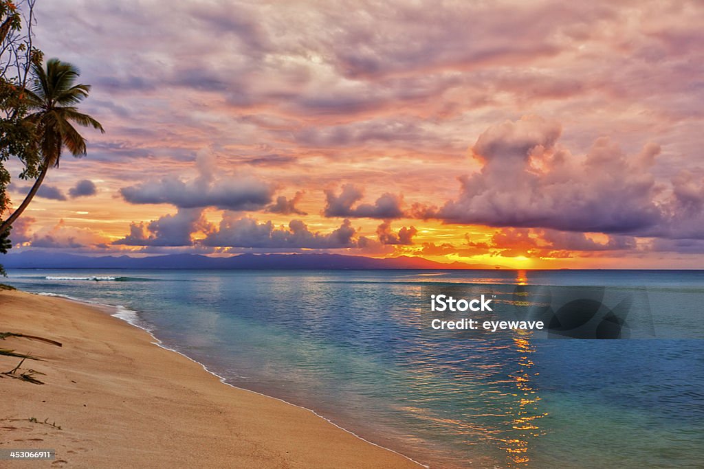 Caribbean beach sunset Vibrant sunset at caribbean island beach Guadeloupe Stock Photo