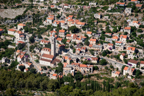 Church of St John and Paul with famous bell tower, work of sculptor Ivan Rendic in Lozisca on island Brac in Croatia