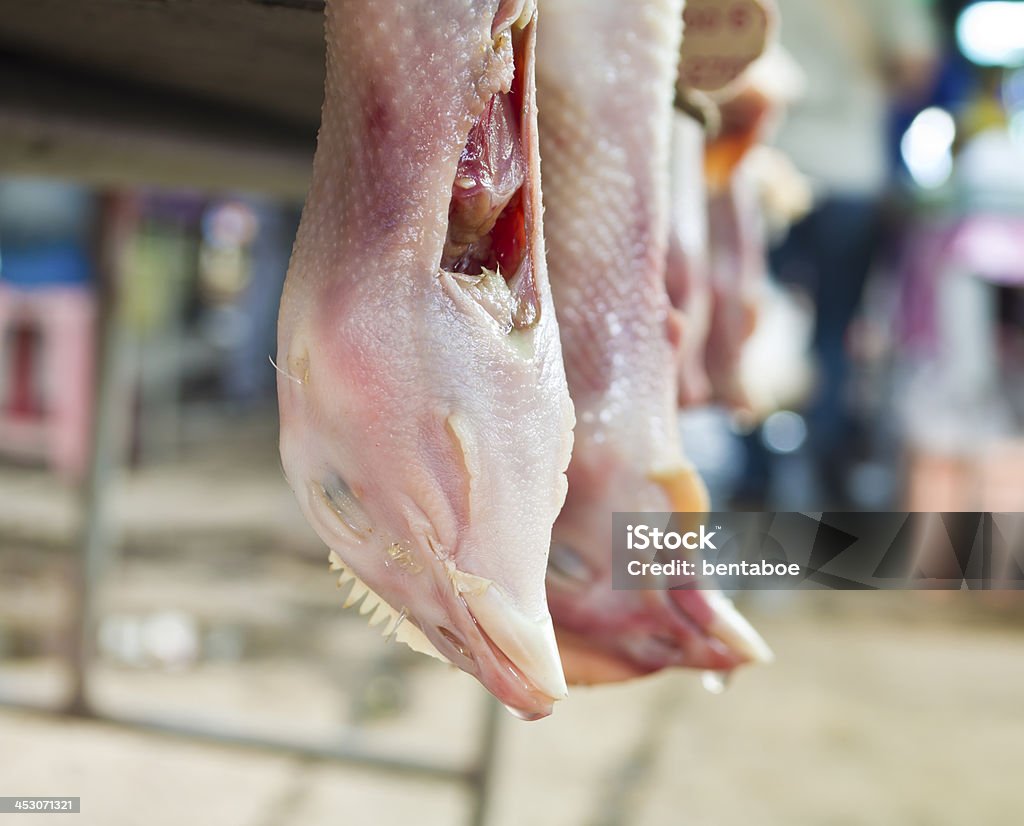 Plucked chicken with slit throat display in a wet market Animal Body Part Stock Photo