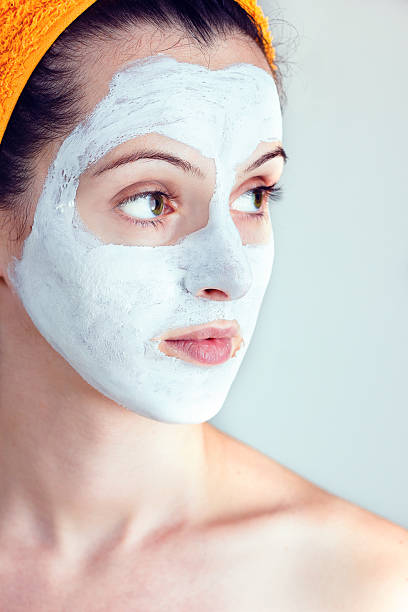 istock Woman having a white smoothing face mask 453091793
