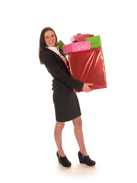 istock beautiful young lady with Christmas gifts 453094295