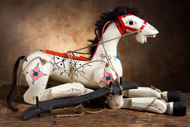Very old antique wooden horse with its original marionette strings