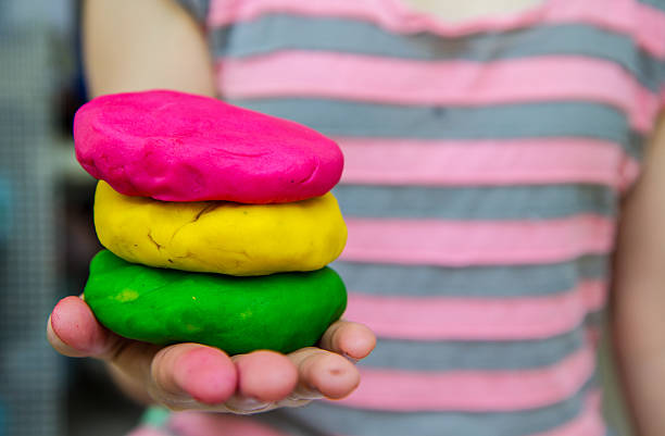 istock Colorful  play dough on hand 453102535