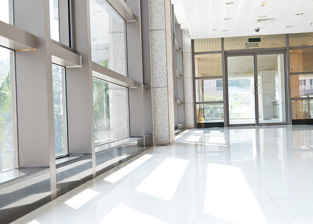istock Corridor of an office building filled with windows 453107233