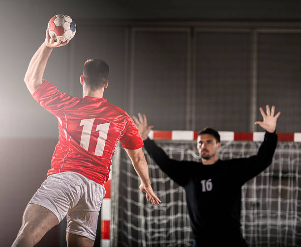 istock Handball player shooting at goal. 453107301
