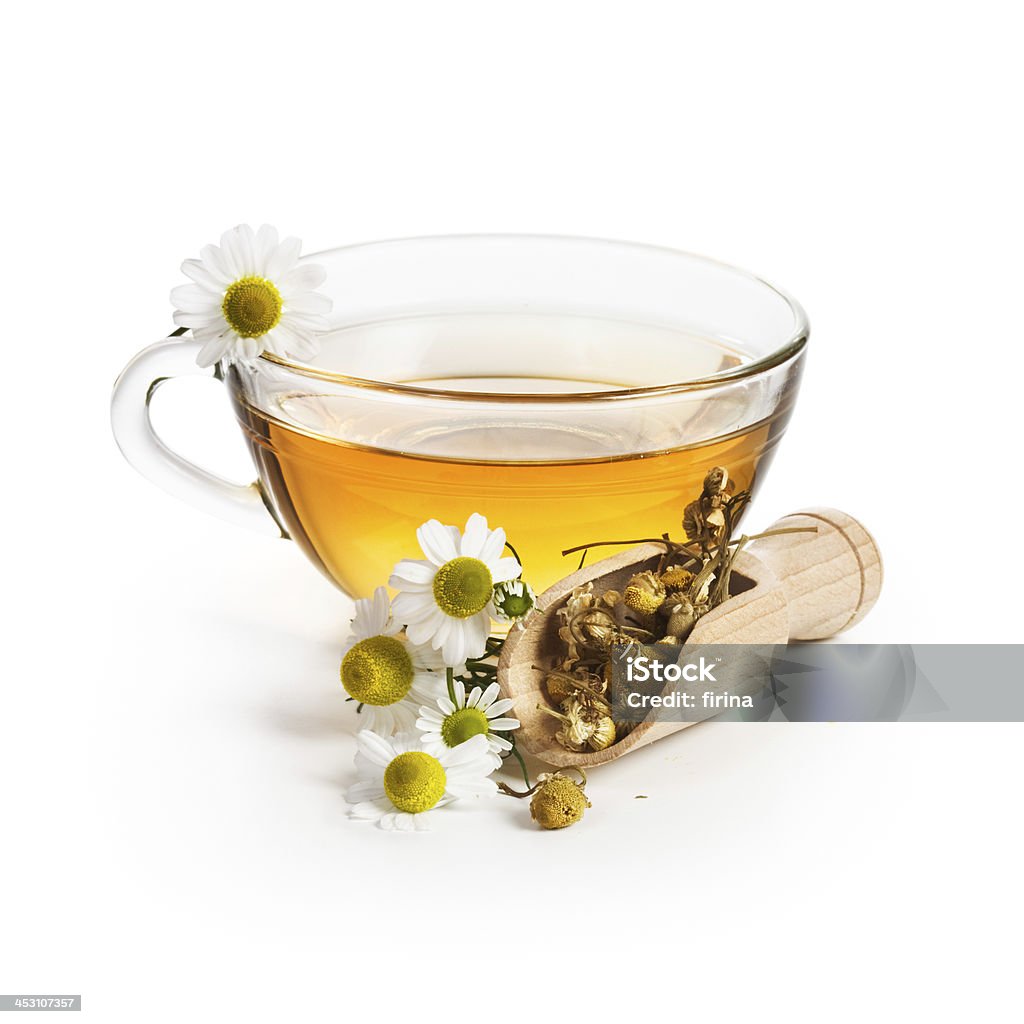 Chamomile Tea Herbal tea with chamomile flowers on white background Dried Tea Leaves Stock Photo