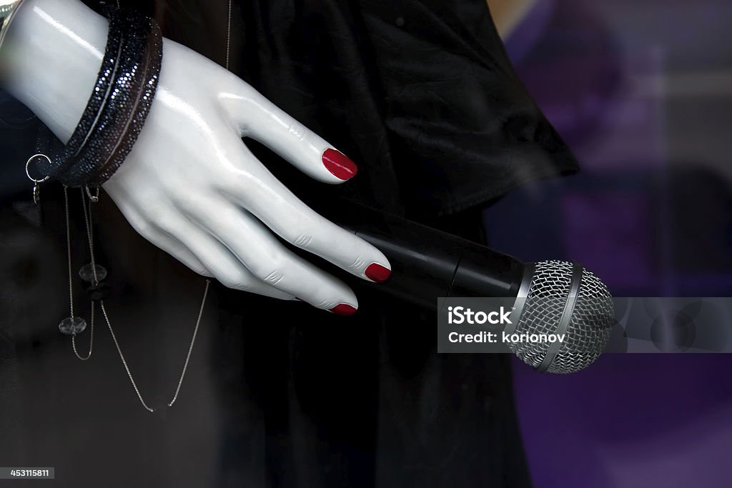 Mannequin hand with the microphone Mannequin hand with the microphone closeup Adult Stock Photo