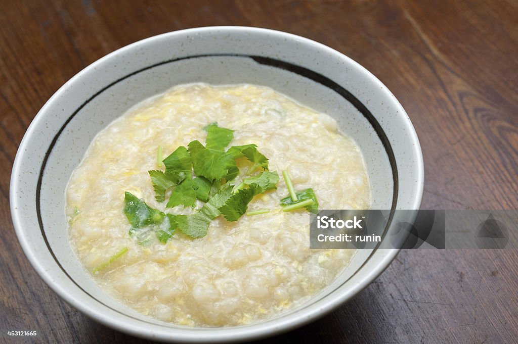 Japanese Cuisine Ojiya Ojiya (おじや): a soup containing rice stewed in stock, often with egg, meat, seafood, vegetables or mushroom, and flavoured with miso or soy. Breakfast Stock Photo