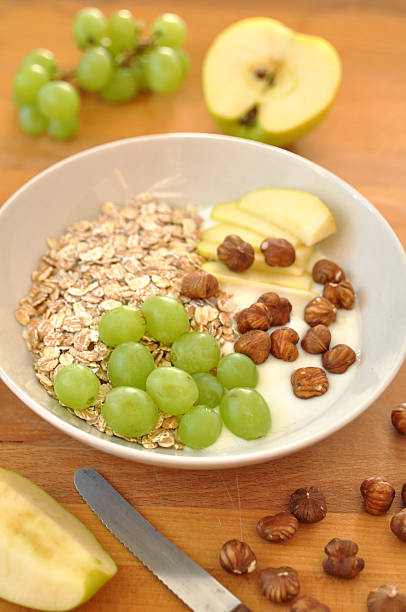 istock Yoghurt with granola, hazelnuts, grapes and apple 453122911