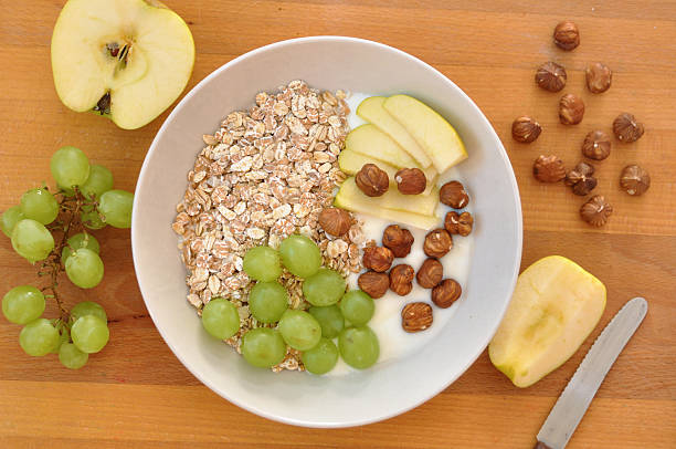 istock Yoghurt with granola, hazelnuts, grapes and apple 453122931