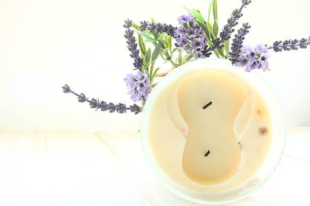 White candle and lilac flower