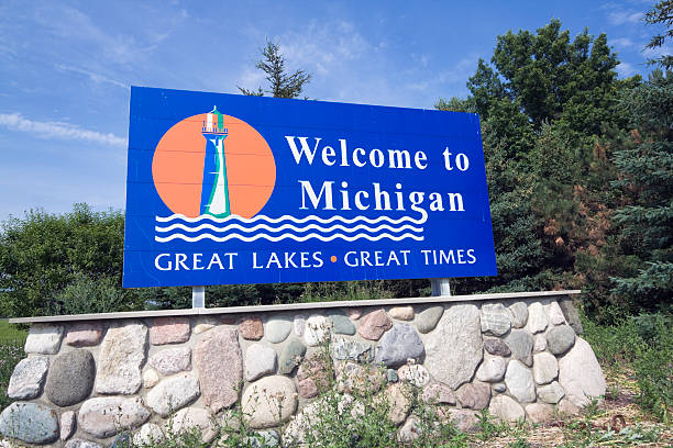 Michigan Welcome Sign Michigan Welcome Sign - summer time. michigan stock pictures, royalty-free photos & images