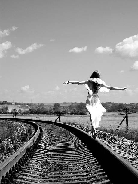 Girl on the railway Pretty girl balancing on the railway railroad track photos stock pictures, royalty-free photos & images