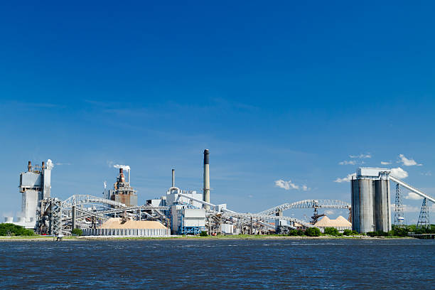 istock Industrial Paper Mill on a River 453128371