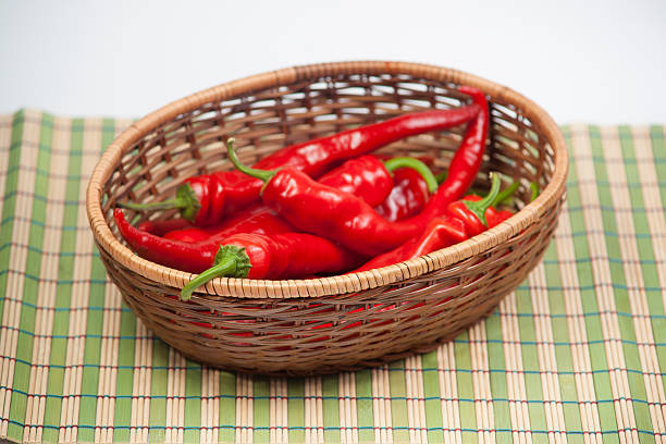 istock Red hot chili pepper in braiding basket 453135575