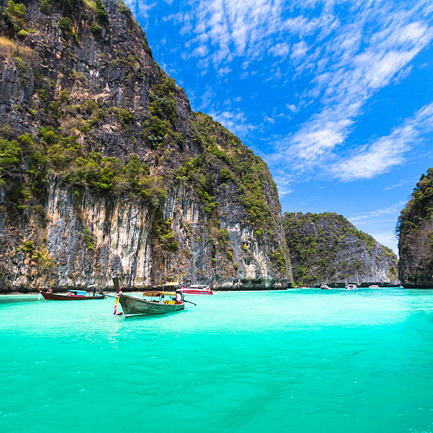 Longtail Boat in Thailand on clear water.