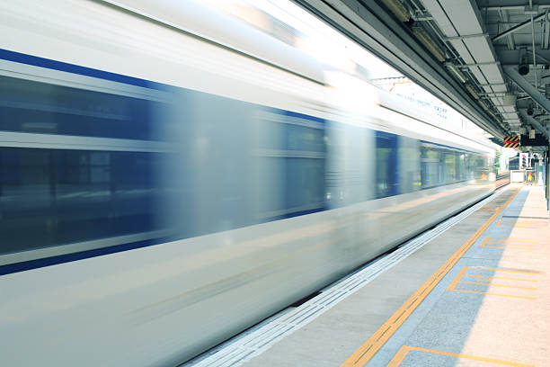 istock speed of train pass though the platform in hong kong 453141523