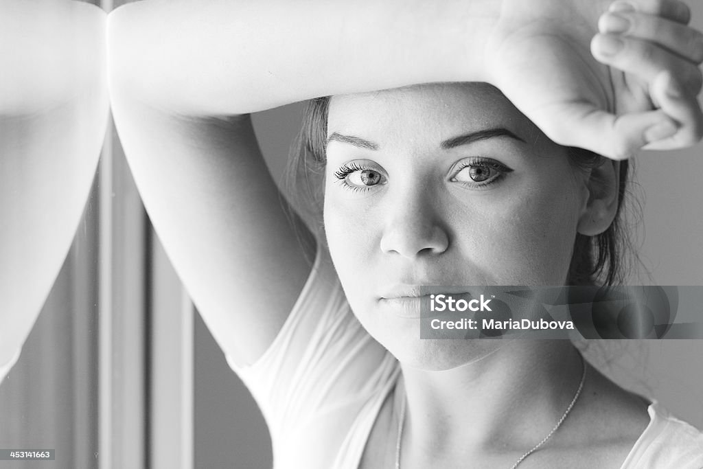 beautiful woman beautiful woman stands in front of the window Adult Stock Photo