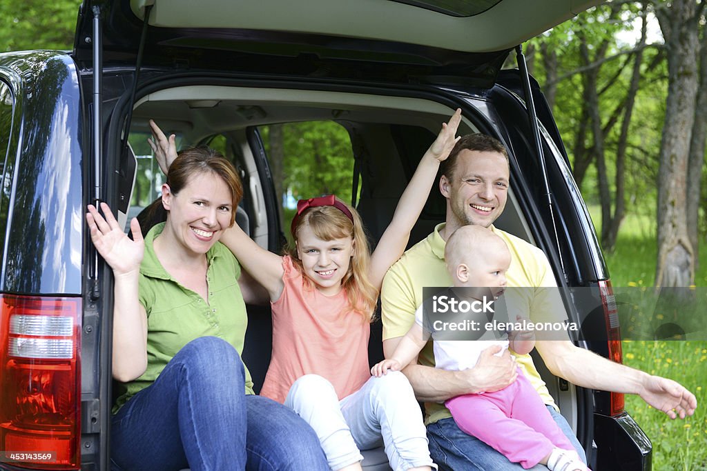 happy family traveling by car 30-34 Years Stock Photo