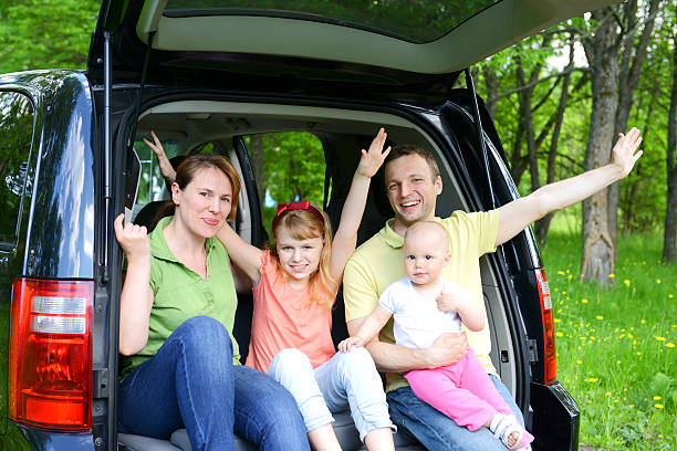 istock happy family traveling by car 453143601